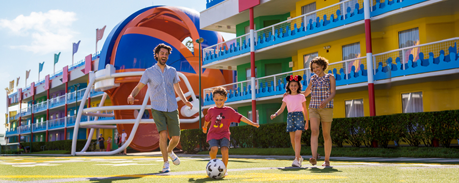 Family playing football at Disney's All Star Sports Resort
