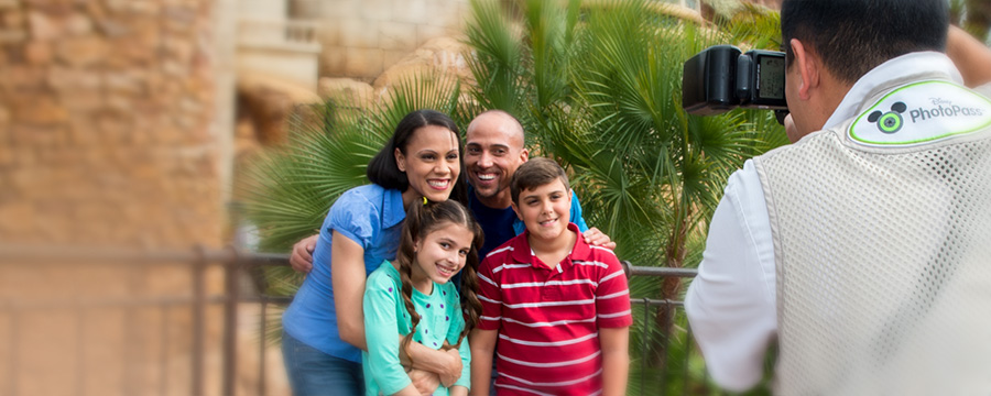 Family having their photo taken by a Disney PhotoPass Photographer
