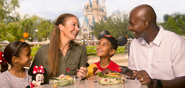 Family enjoying a self-service meal in Magic Kingdom Park