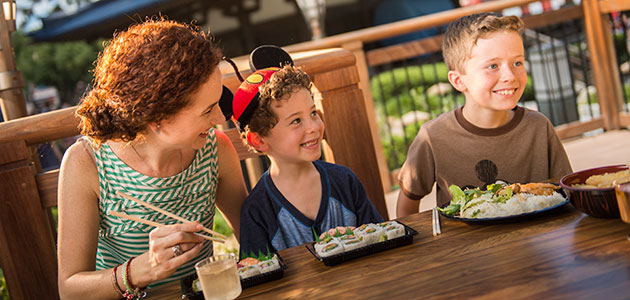 Family enjoying sushi at the Japan Pavilion in Epcot