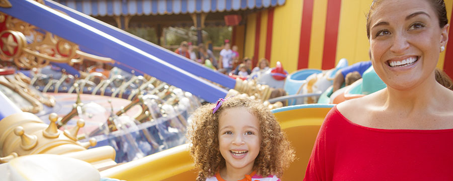 Mother and daughter on Dumbo the Flying Elephant in Magic Kingdom