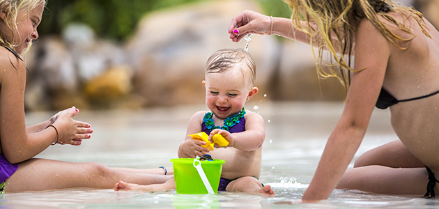 Toddler playing in the water at the Disney Water Parks.