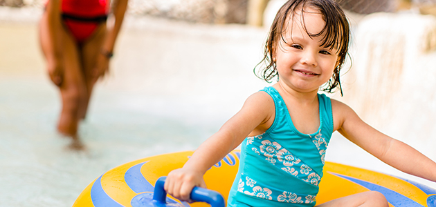 Young girl playing at Ketchakiddee Creek at Disney's Typhoon Lagoon.