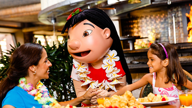Mother and daughter enjoying a character breakfast at Ohana, joined by Lilo