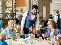 Family enjoying table service meal