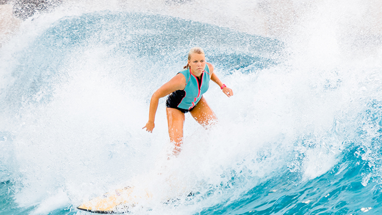 Girl surfing at Typhoon Lagoon