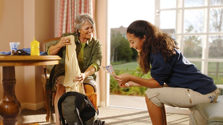 Grandmother and granddaughter unpacking at Saratoga Springs