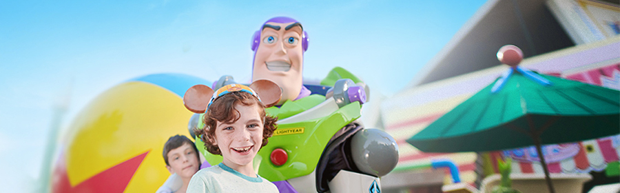 Young boy with Buzz Lightyear at Toy Story Land